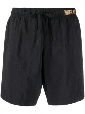 Плавки-шорты с логотипом Moschino. Цвет: черный