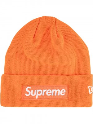 Шапка бини New Era с логотипом Supreme. Цвет: оранжевый